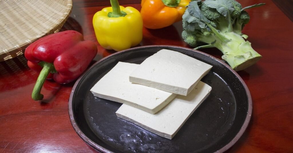 "Slice of tofu served on a plate"